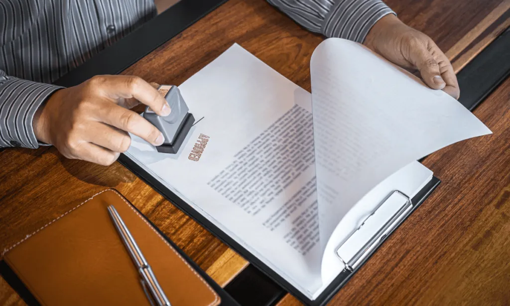 Stamping documents on a wooden table